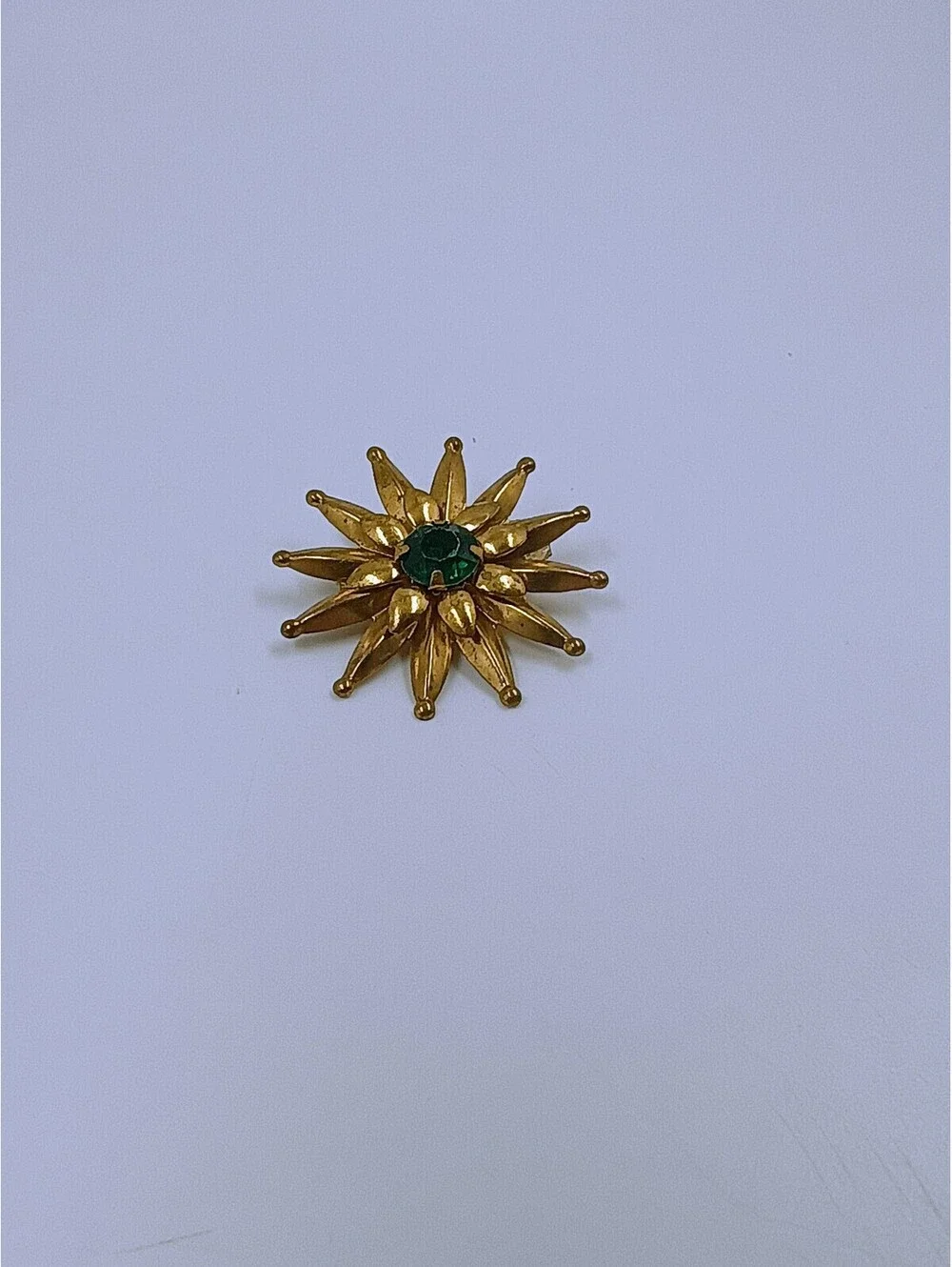Vintage Gold-Tone Starburst Brooch with Green Center Stone